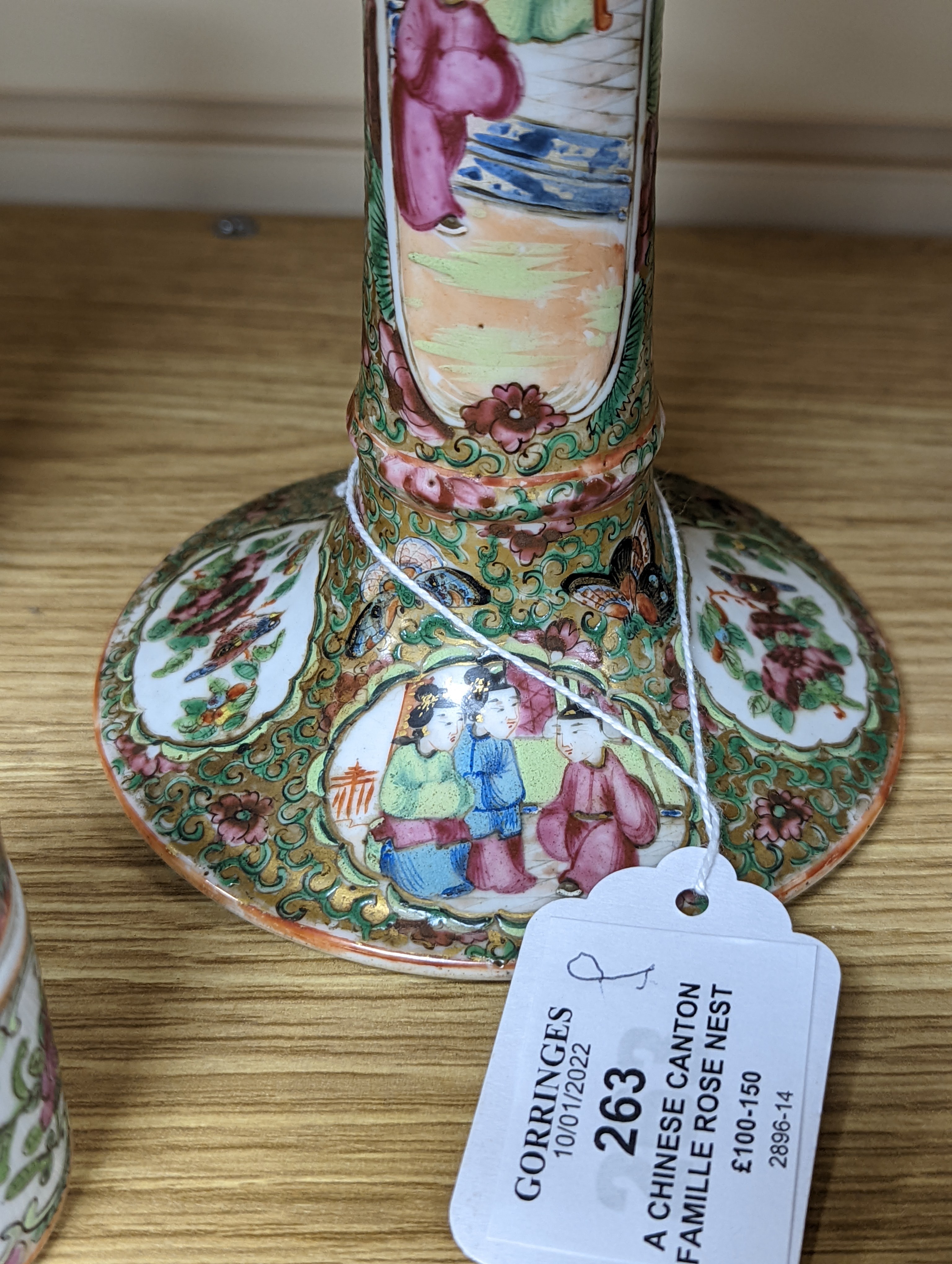 A Chinese Canton famille rose nest of boxes and covers, a similar candlestick and a tray 23cm